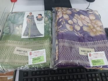Nancy 09310-A Purple And Green colour Dola Silk Saree CM1468312